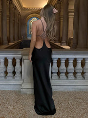 Black halter neck backless gown with diamond buckle detail