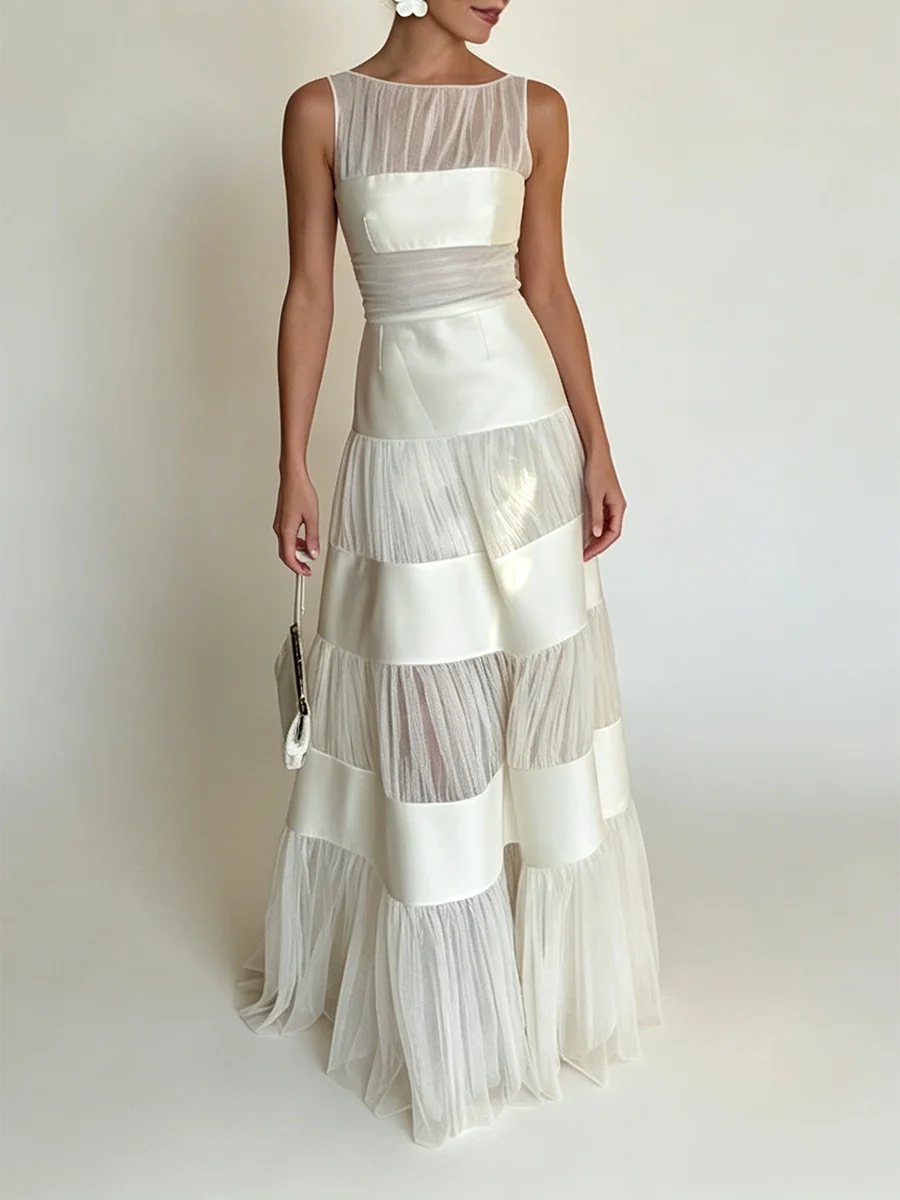 O-neck sleeveless maxi dress with mesh and satin panels in studio setting