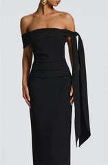 Black off-shoulder dress with a bow detail