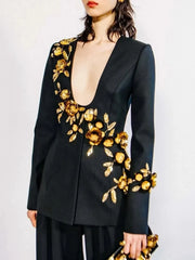 Black blazer with gold floral embroidery on a plain background