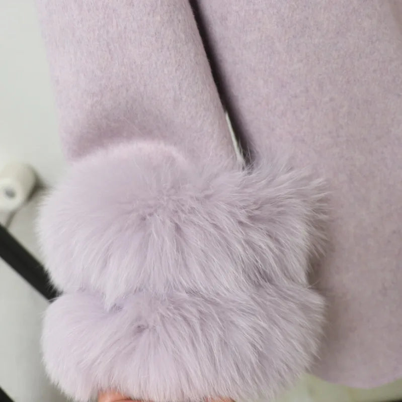 Close-up of a light purple coat with fluffy cuffs on a white background