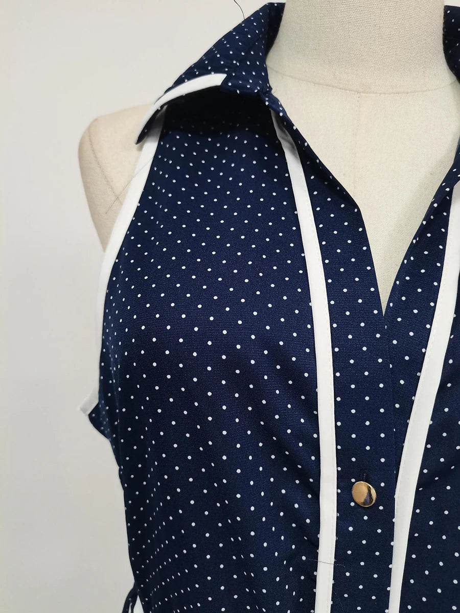 Navy blue shirt with white polka dots on a mannequin