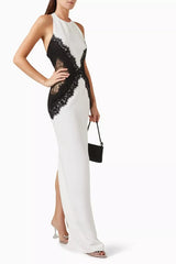 Woman wearing a white dress with black lace details