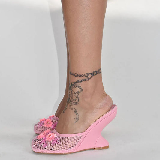 Pink mesh wedge heels with floral appliques