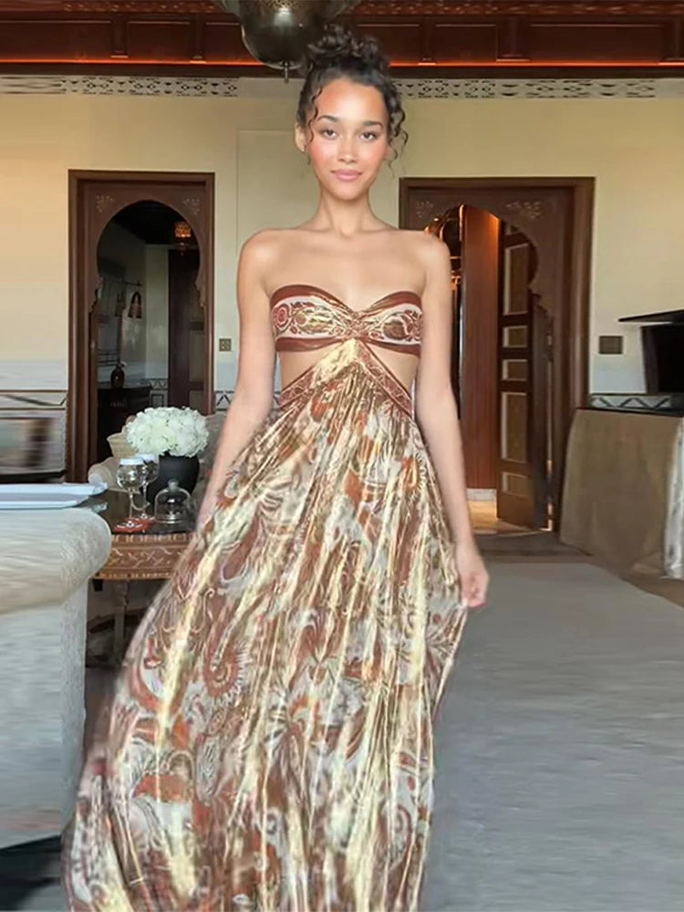 Woman wearing a strapless, patterned dress in an indoor setting