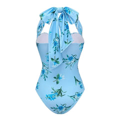Back view of a blue floral print halter neck one-piece swimsuit.