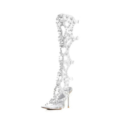 Clear high-heeled shoe with floral embellishments