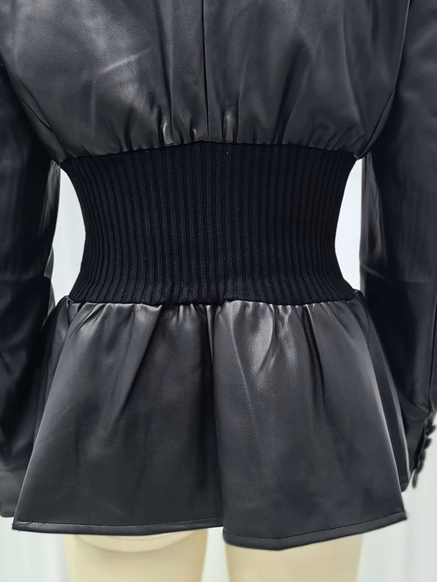 Black leather jacket with a ribbed waistband on a mannequin.