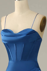 Blue dress on a mannequin against a gray background