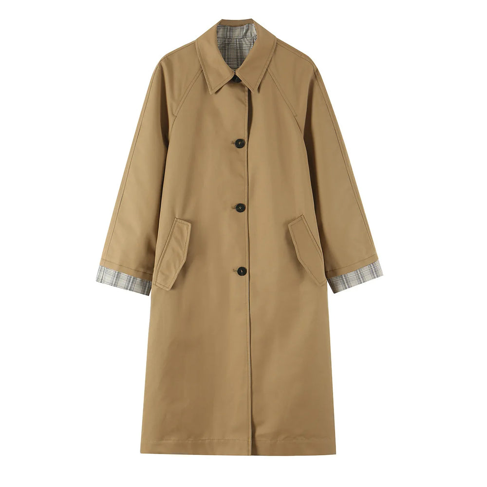 Reversible coat with plaid lining, lapel collar, and button closure.