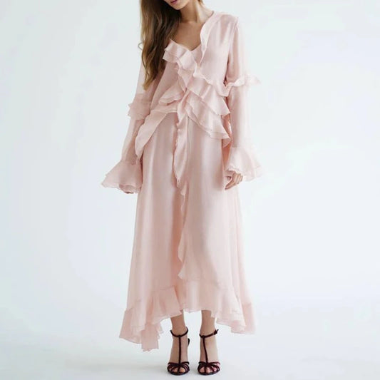 Pink ruffled dress on a white background