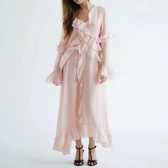 Pink ruffled dress on a white background