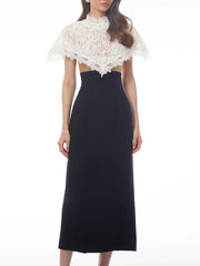 Sheath dress with a white lace cape overlay, slight angle view.