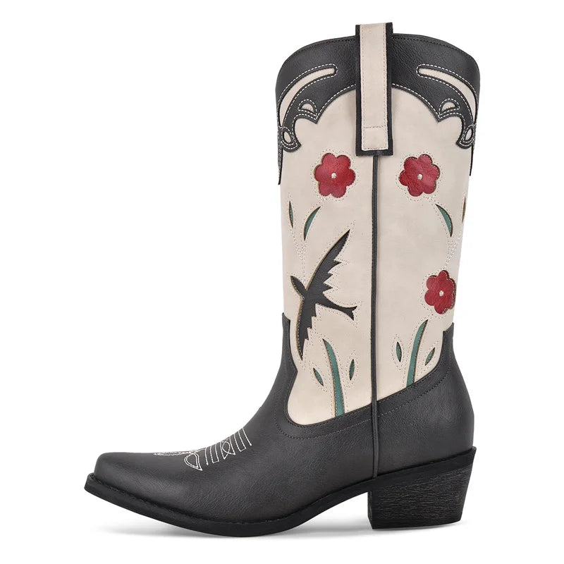 Black and white cowboy boot with floral design on a white background