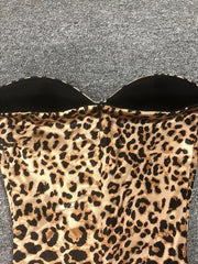 Leopard print strapless top on a gray background