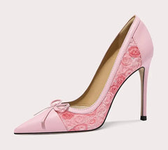 Pink high-heeled shoe with floral design on a white background