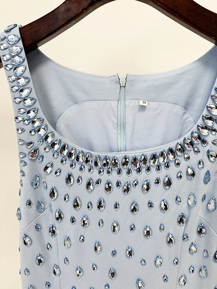Light blue dress with sparkling embellishments on a hanger