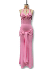 Pink evening gown on a mannequin against a white background