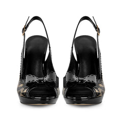 Front view of a pair of leopard print patent leather Pumps with bows