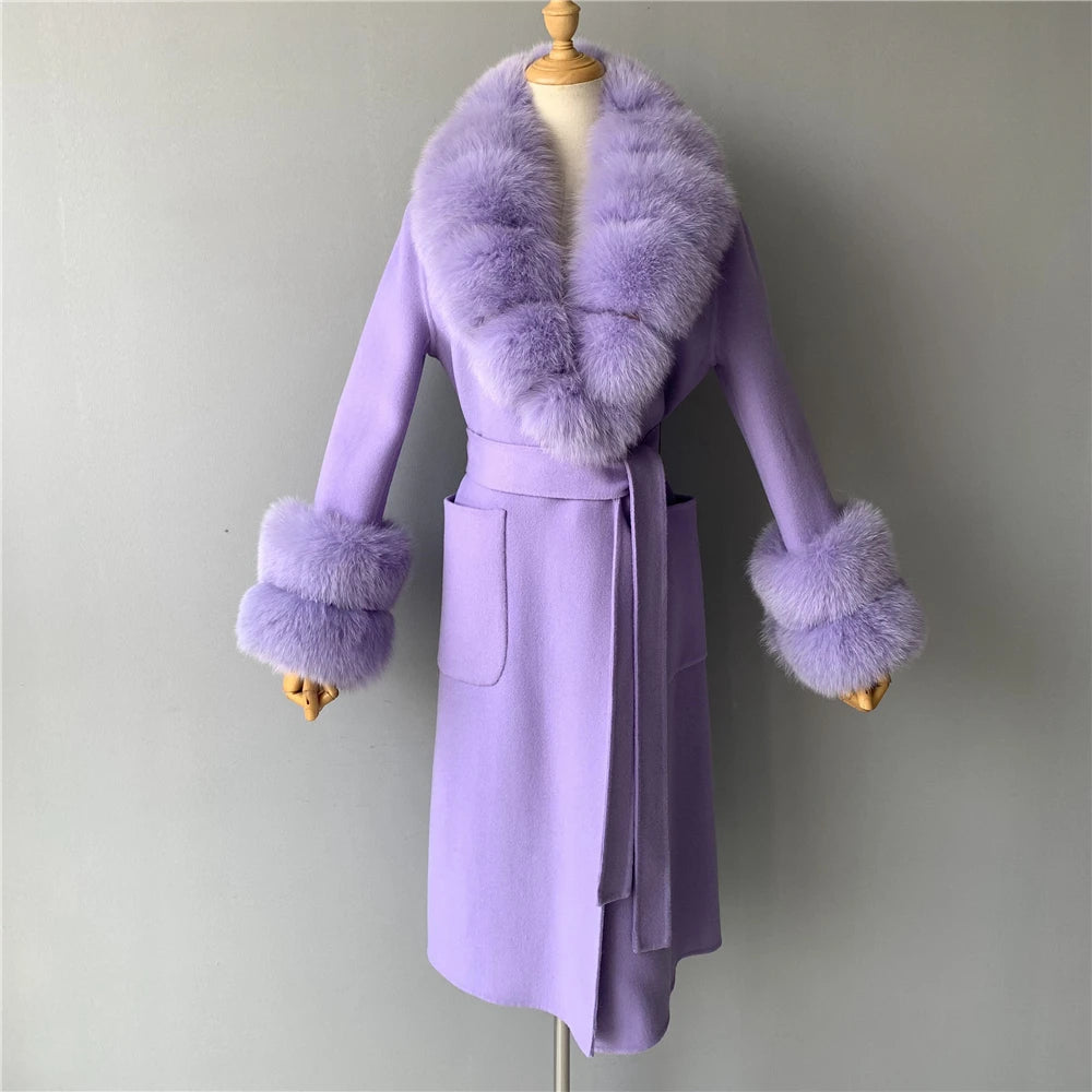 Purple coat with fur trim on a mannequin against a plain background