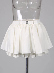 White skirt on a mannequin against a gray background