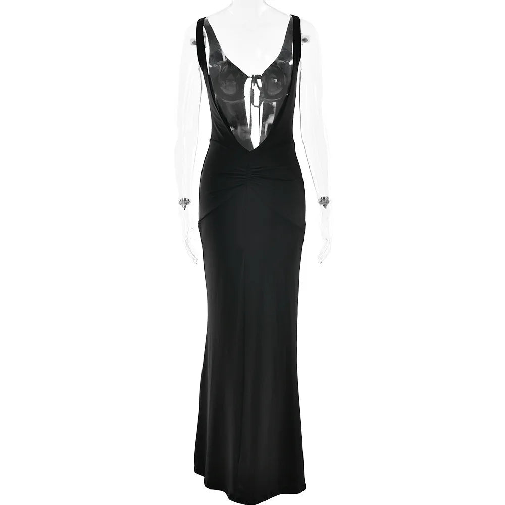 Black evening gown with sheer back on a white background