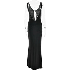 Black evening gown with sheer back on a white background