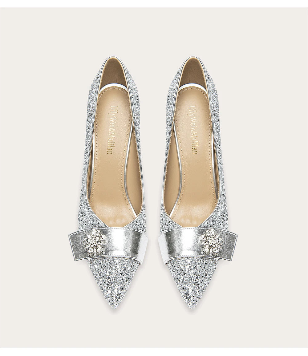 Silver glittery high heels on a white background