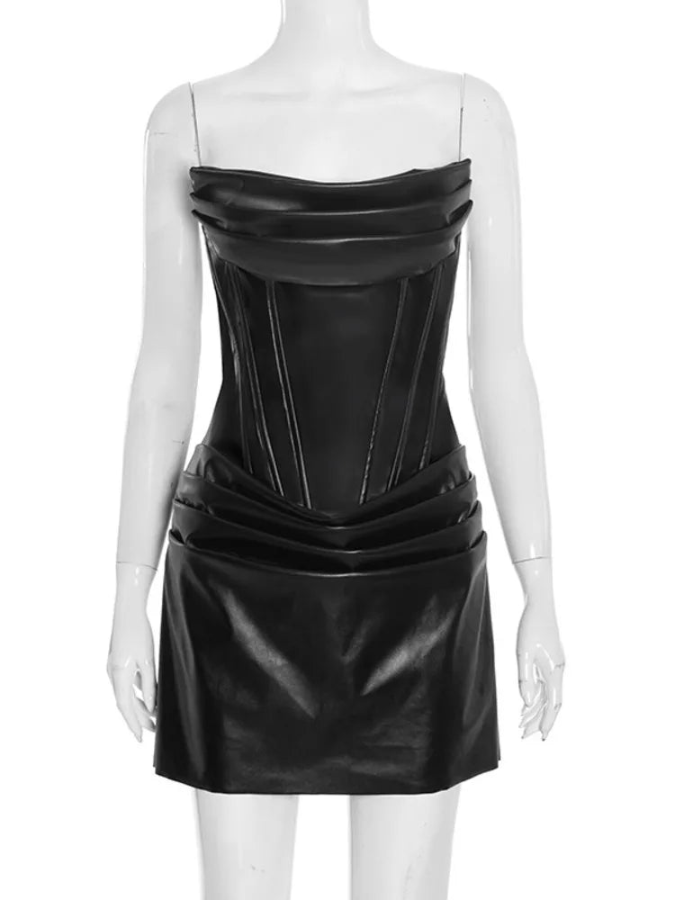 Black leather dress on a mannequin against a white background