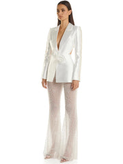 Pearl embellished cutout blazer and sheer beaded flare pants suit on model