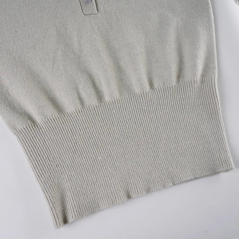 Gray knit sweater on a white background