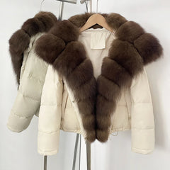 White puffer jacket with brown fur trim on a hanger against a white background