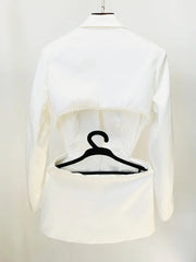 White blouse on a mannequin with a black hanger inside, against a white background