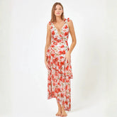 Botanical print two-piece swimwear set with ruffled neckline and adjustable ties.