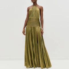 Woman wearing a gold pleated dress on a white background