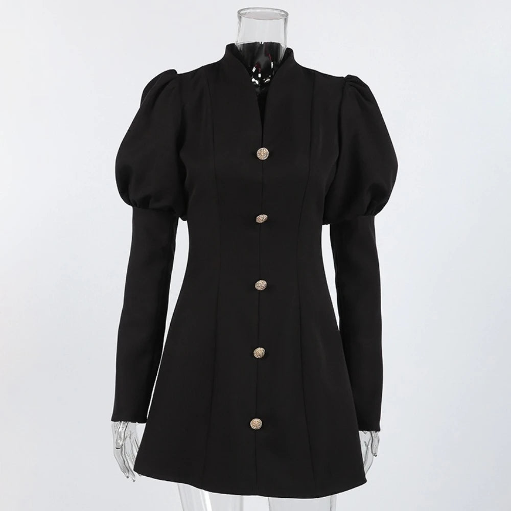 Black dress with puffed sleeves on a mannequin against a white background