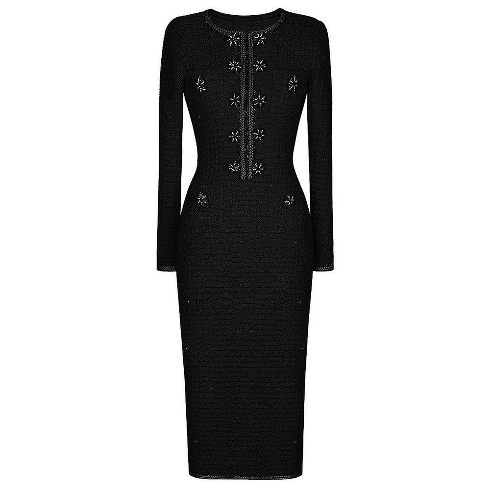 Black dress with floral embellishments on a white background