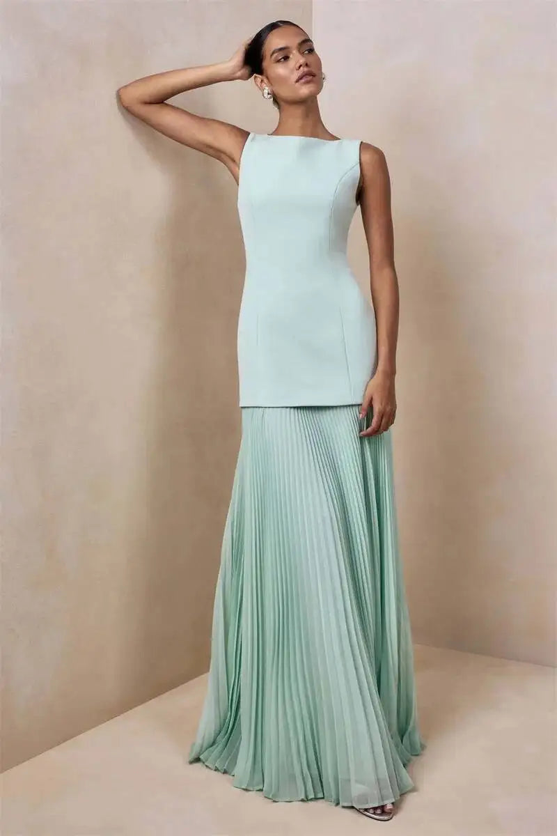 Boat neck sleeveless dress with a floor-length pleated skirt in mint green.