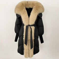 Black winter coat with beige fur trim on a white background