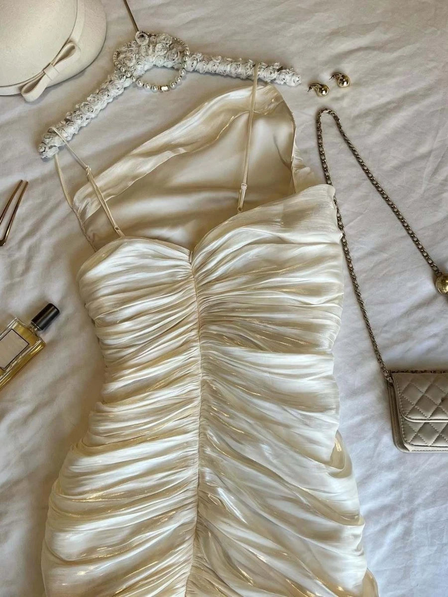 White dress with accessories on a light background