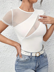 Person wearing a white bodysuit with sheer sleeves against a light gray background