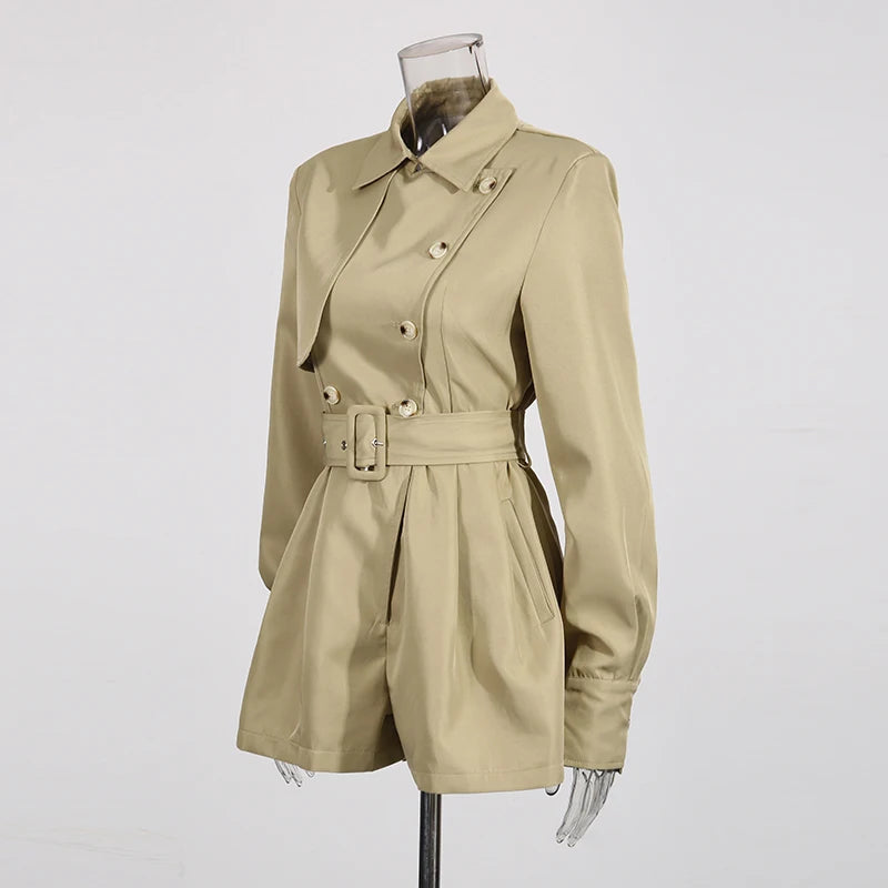 Beige trench coat on a mannequin against a white background
