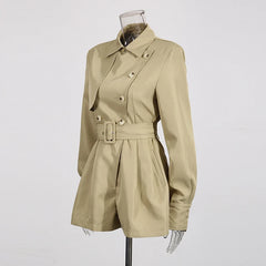Beige trench coat on a mannequin against a white background