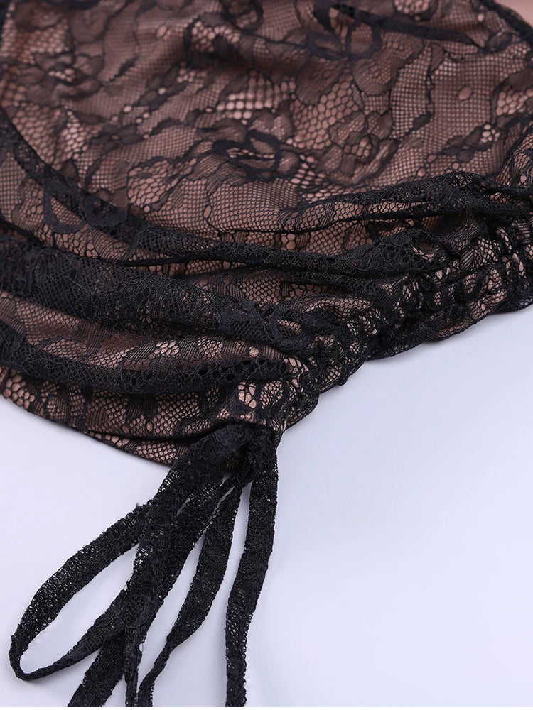 Close-up of black lace fabric on a white background