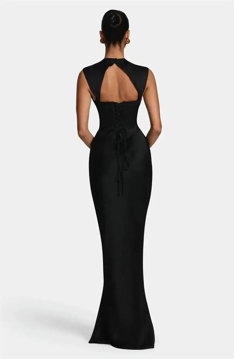 Back view of merlot satin cowl neck mermaid maxi dress with lace-up detail