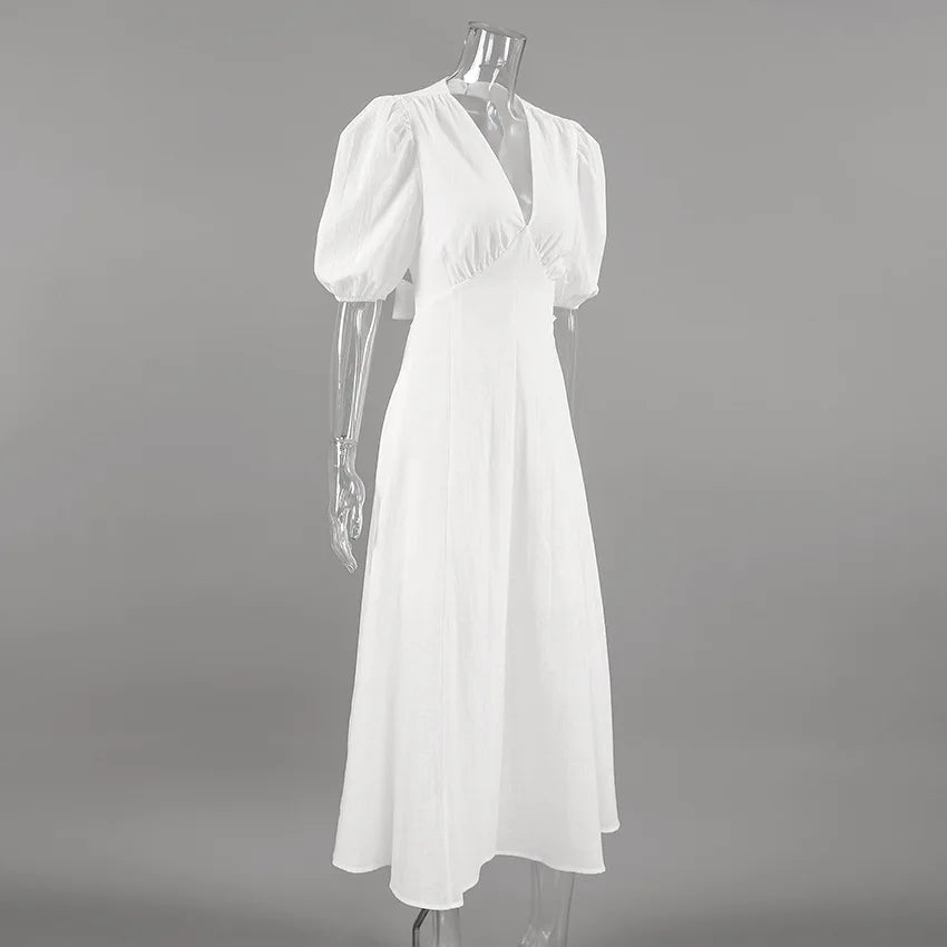 White dress on a mannequin against a gray background