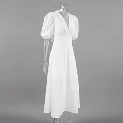 White dress on a mannequin against a gray background