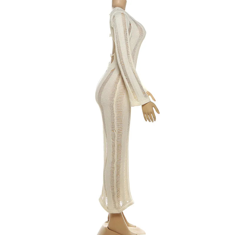 Mannequin wearing a long, sheer beige dress