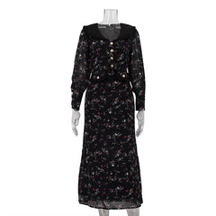 Black floral dress on a mannequin against a white background