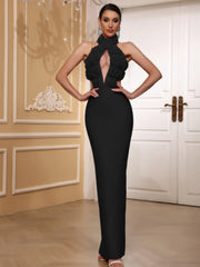 Woman wearing a black evening gown in an elegant room.